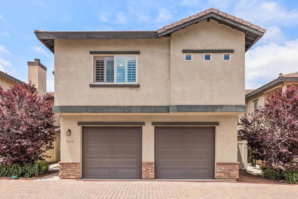 a front view of a house with garage