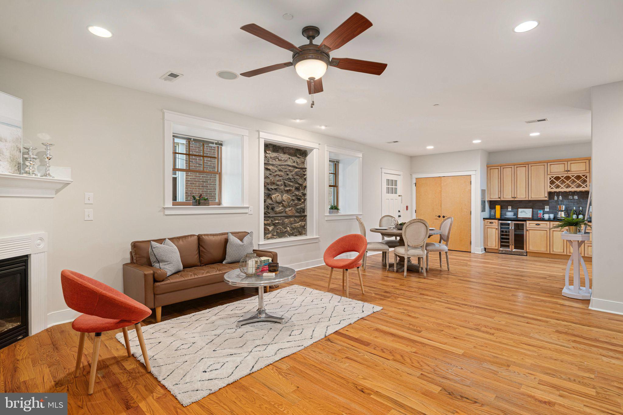 a living room with furniture and kitchen view