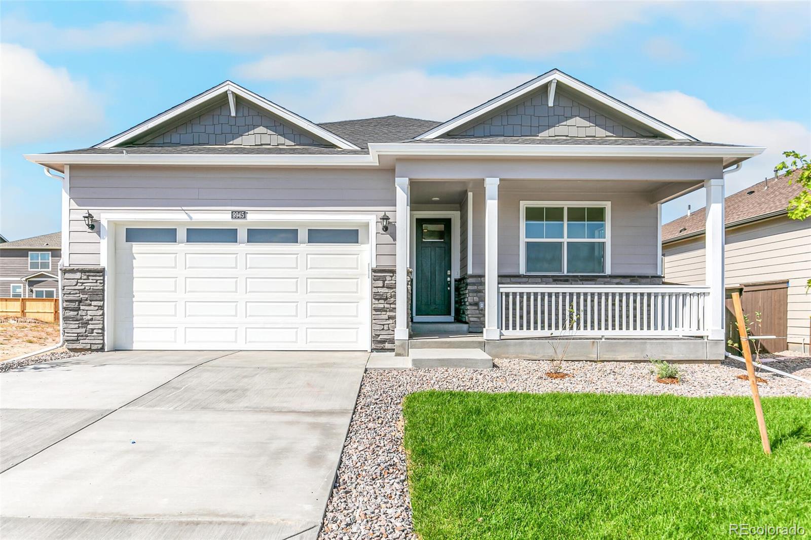 front view of a house with a yard