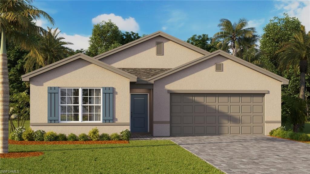 View of front of home with a front yard and a garage