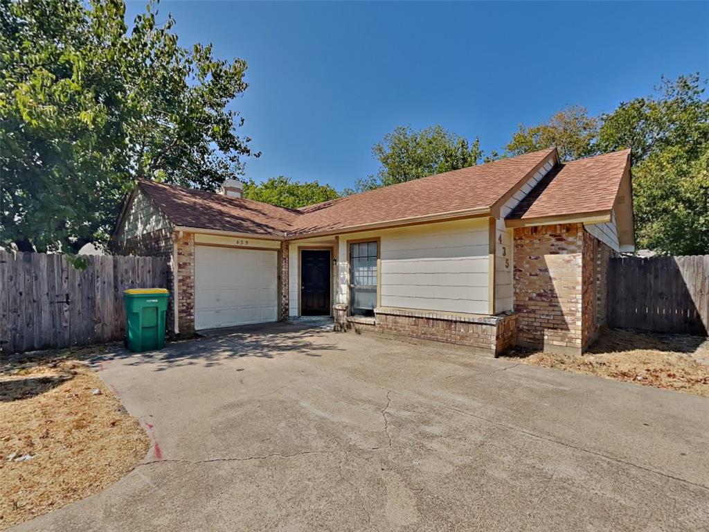 a view of a house with a yard and garage