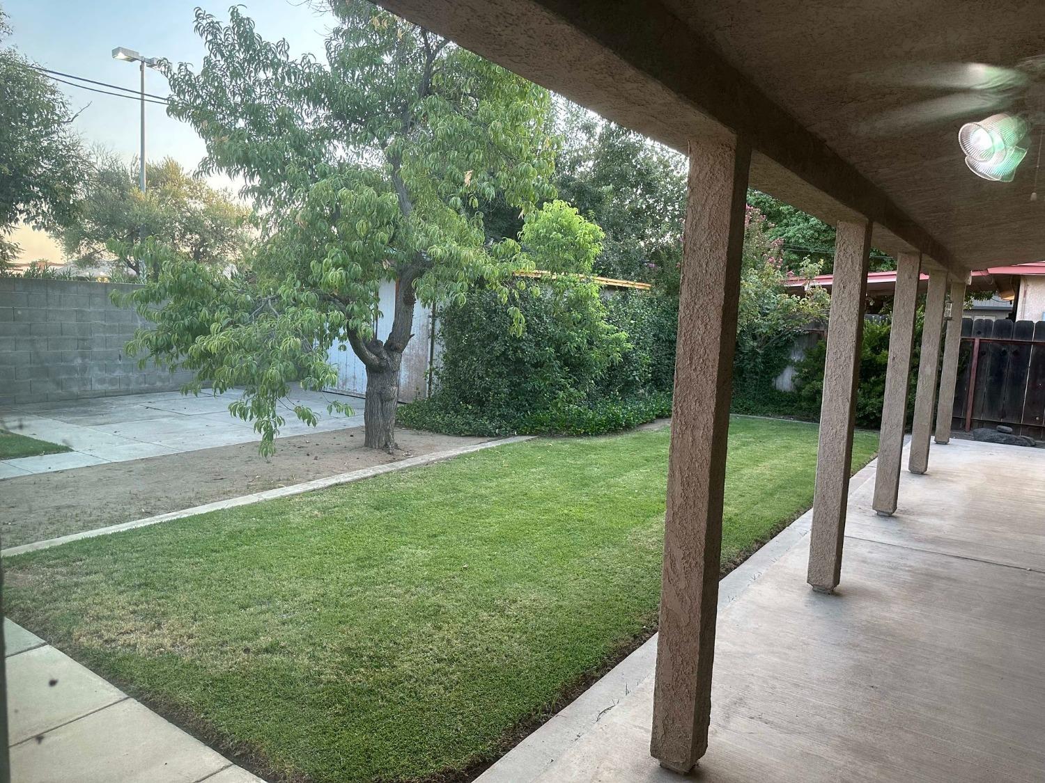 a backyard of a house with lots of green space