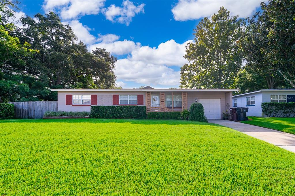 a view of a house with a yard