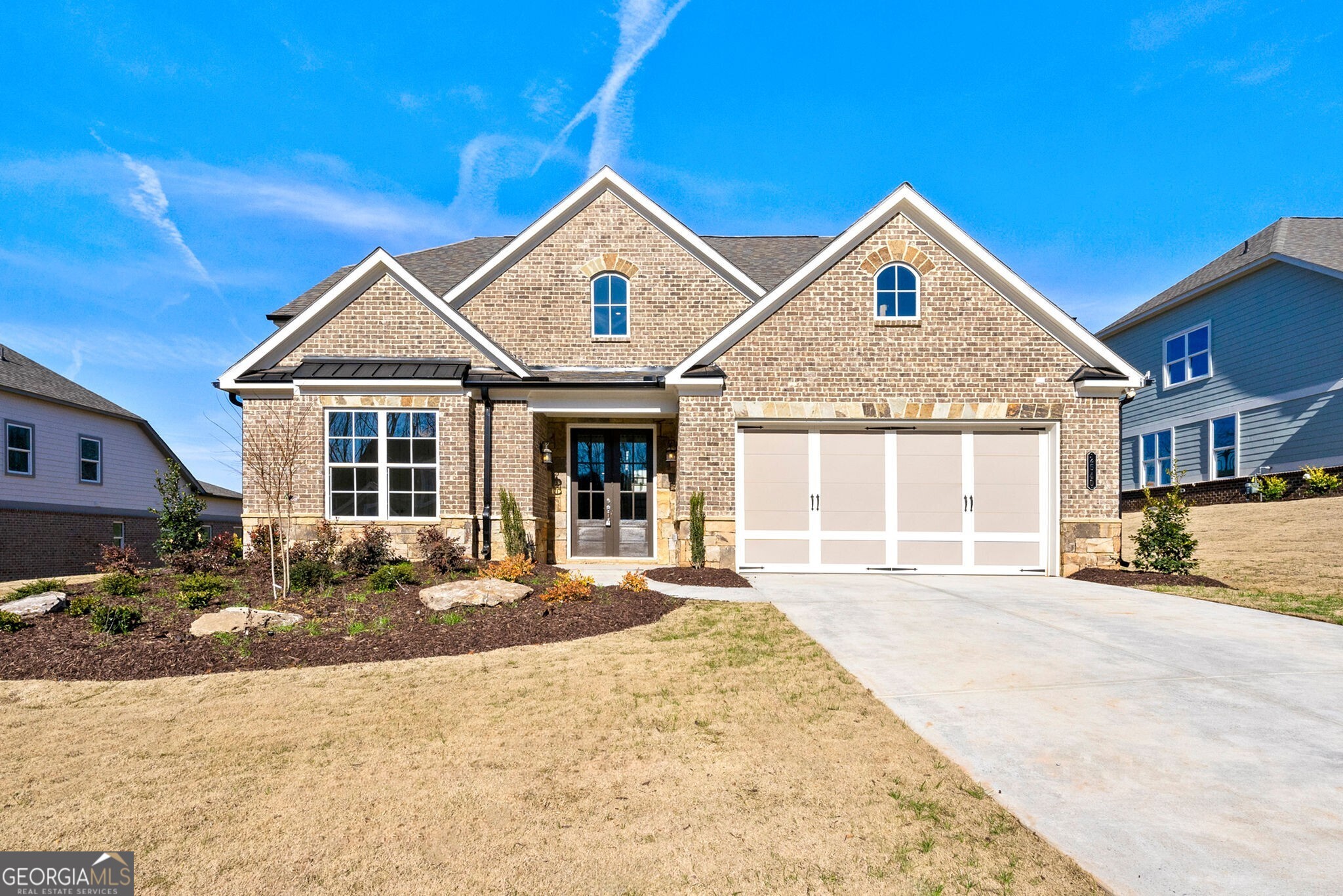 a front view of a house with a yard