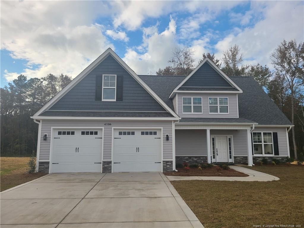 front view of a house with a yard