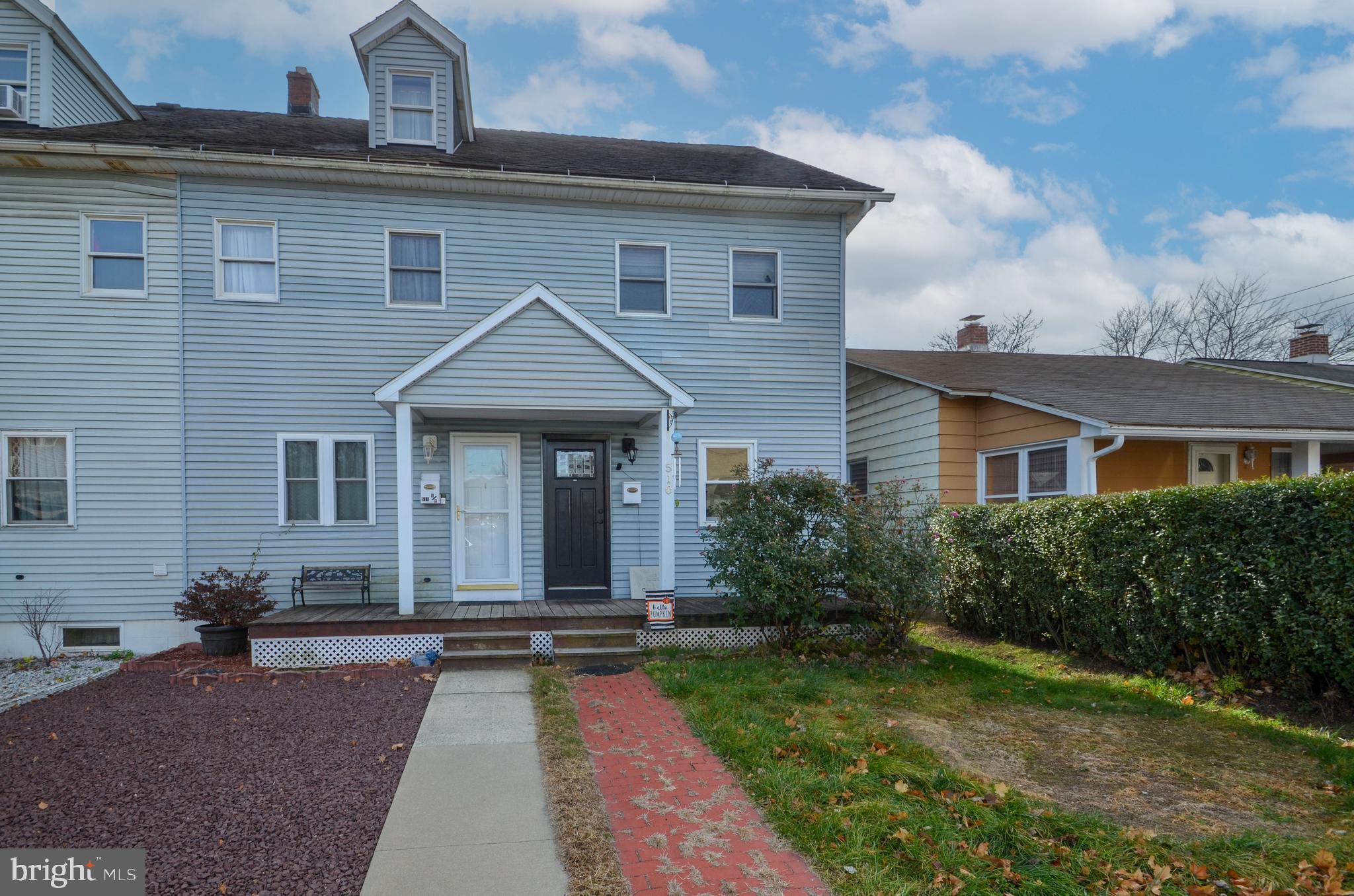 a front view of a house with yard