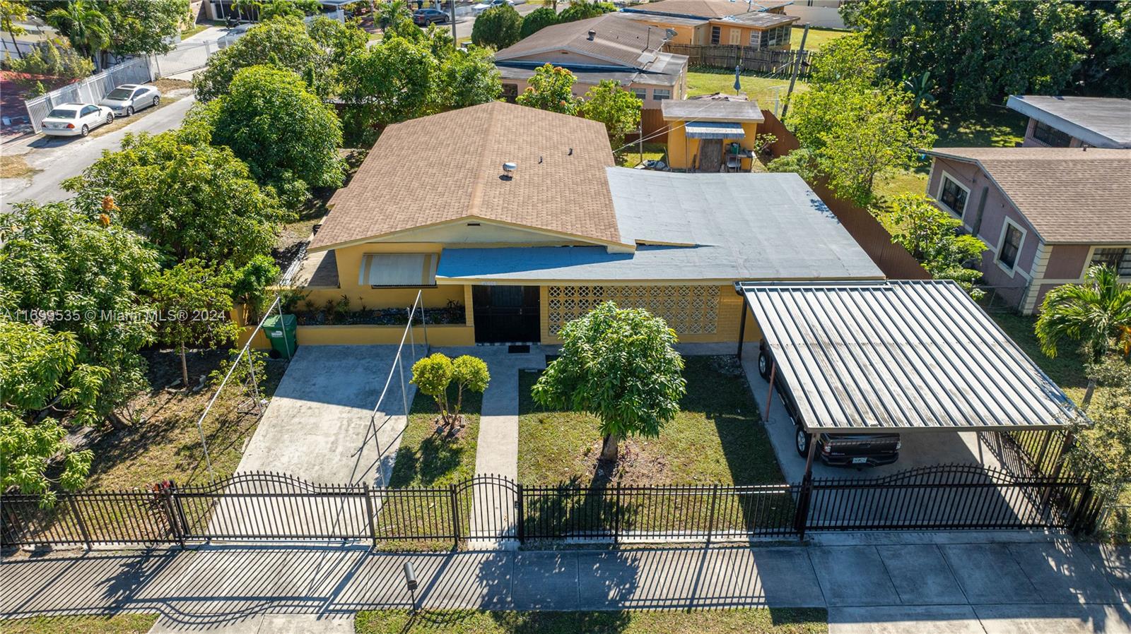 an aerial view of a house roof deck patio and outdoor seating