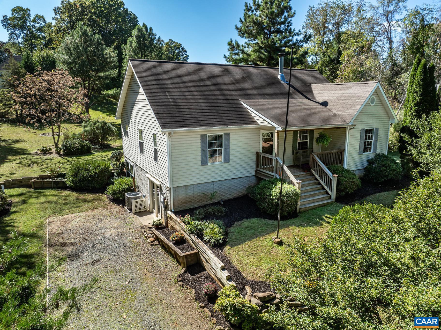 an aerial view of a house with garden