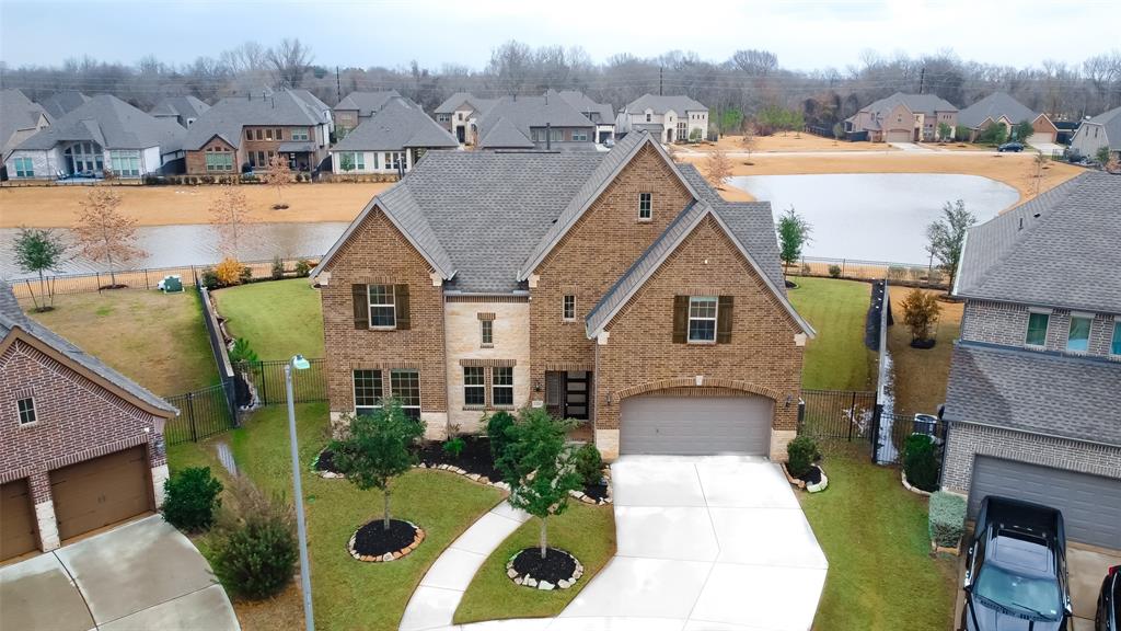 an aerial view of a house with swimming pool