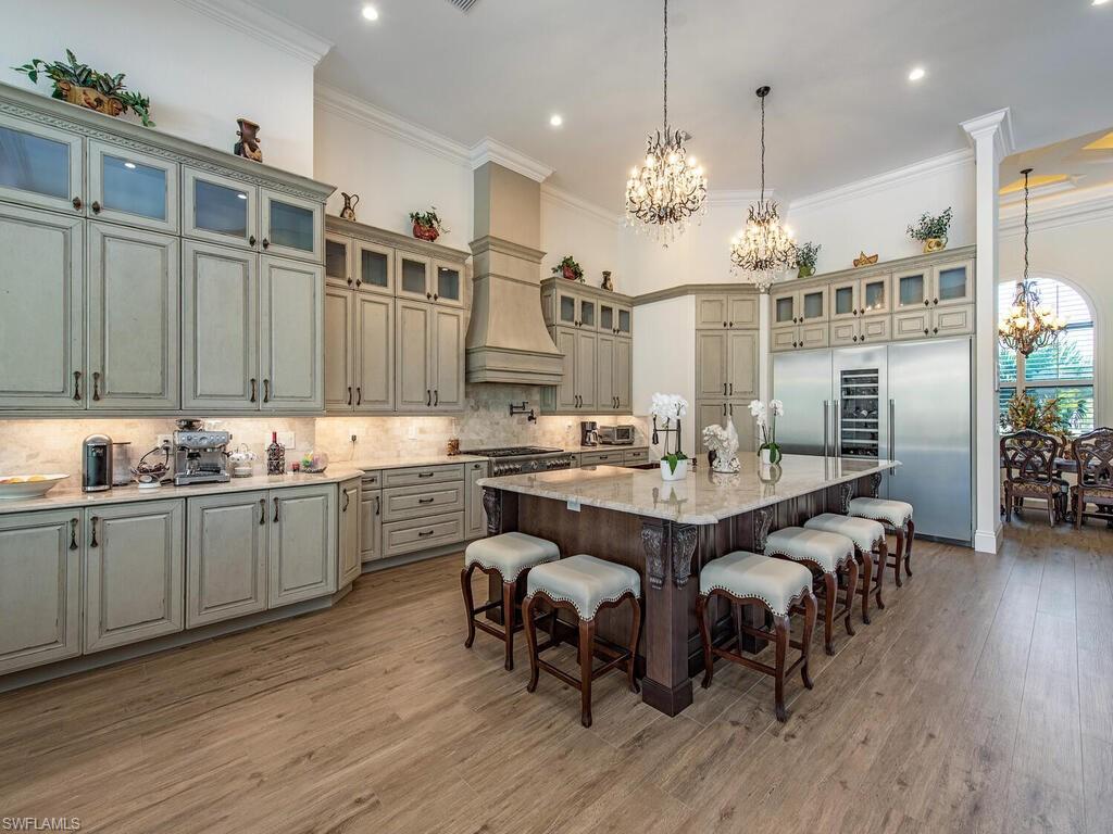 a large kitchen with a table and chairs