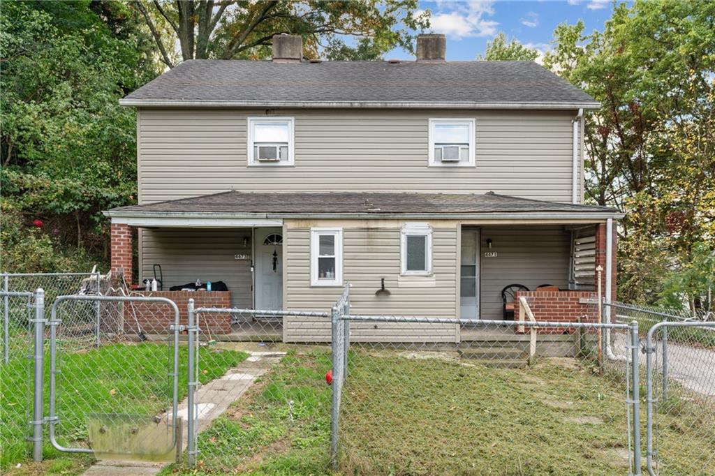 front view of a house with a yard