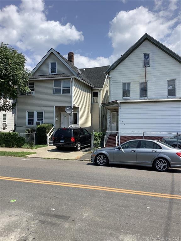 a view of a car parked in front of a house