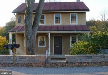 a front view of a house with yard