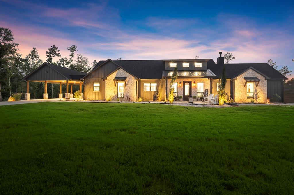 a front view of a house with a big yard