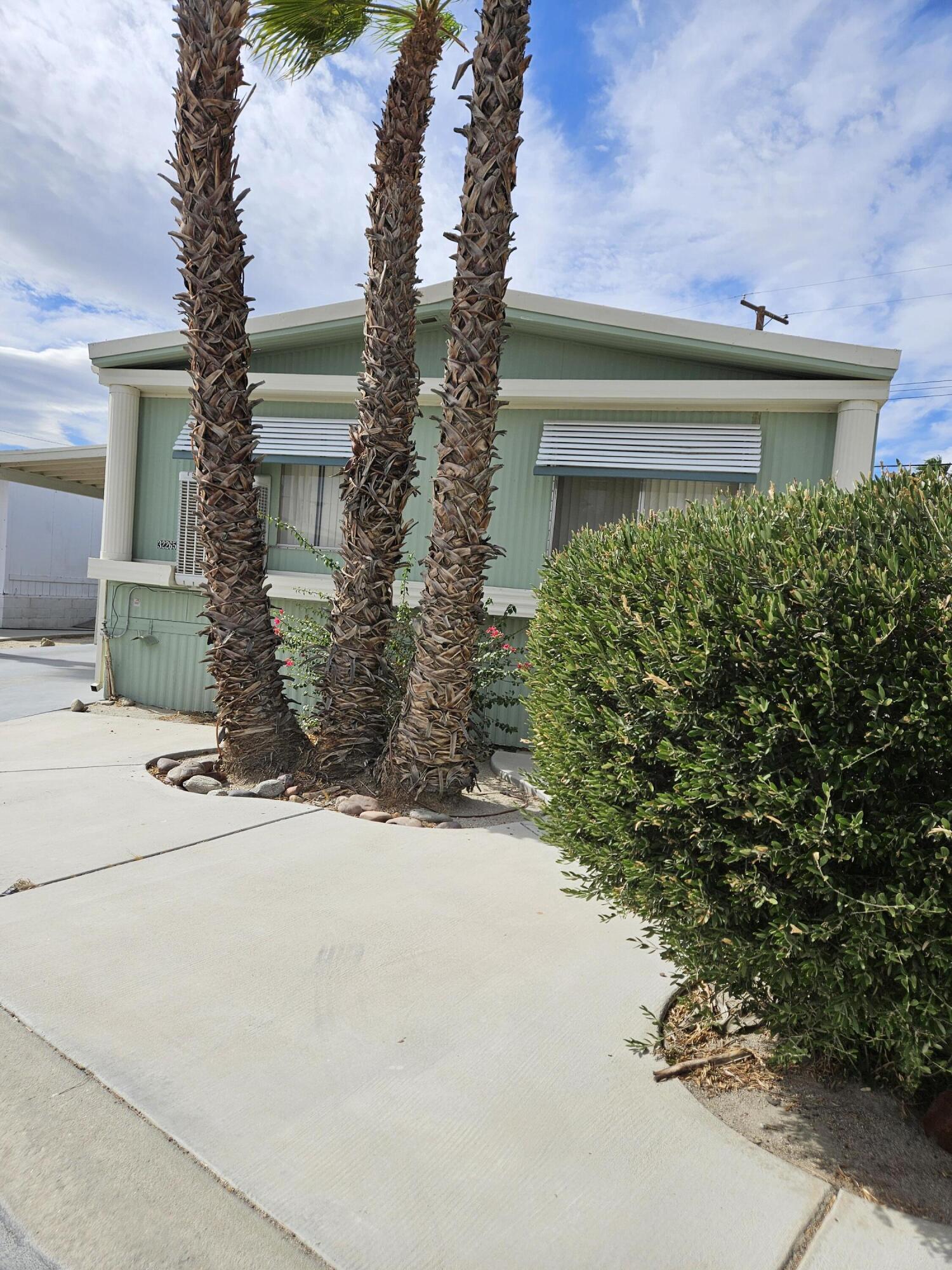 a view of a house with a yard and garage