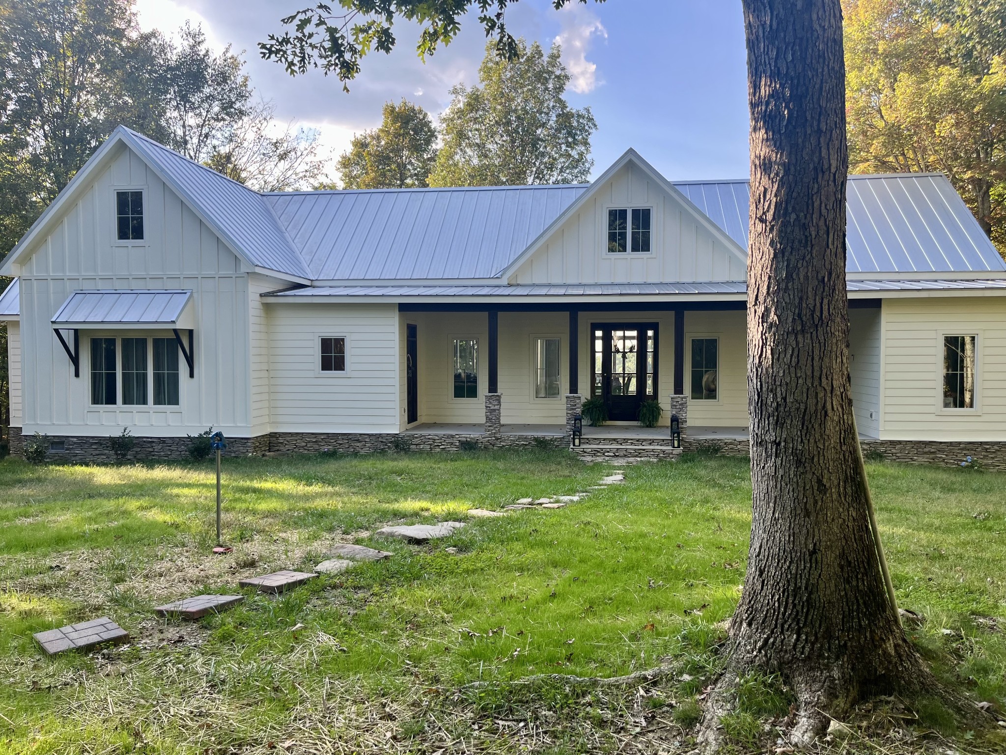 a front view of a house with a yard