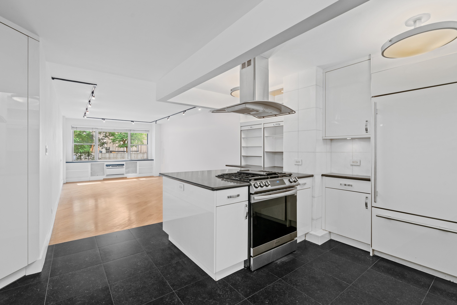 a kitchen with a stove and a refrigerator