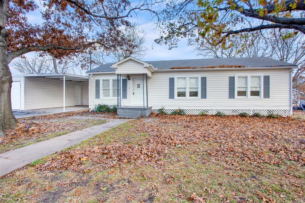 front view of a house with a bench