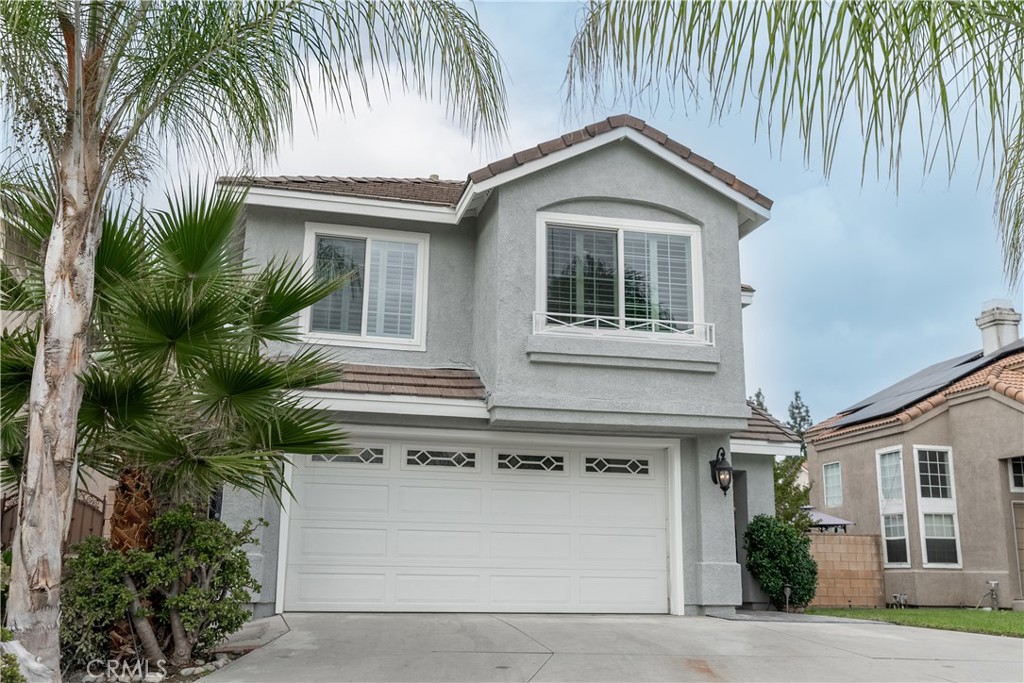 a front view of a house with a garage