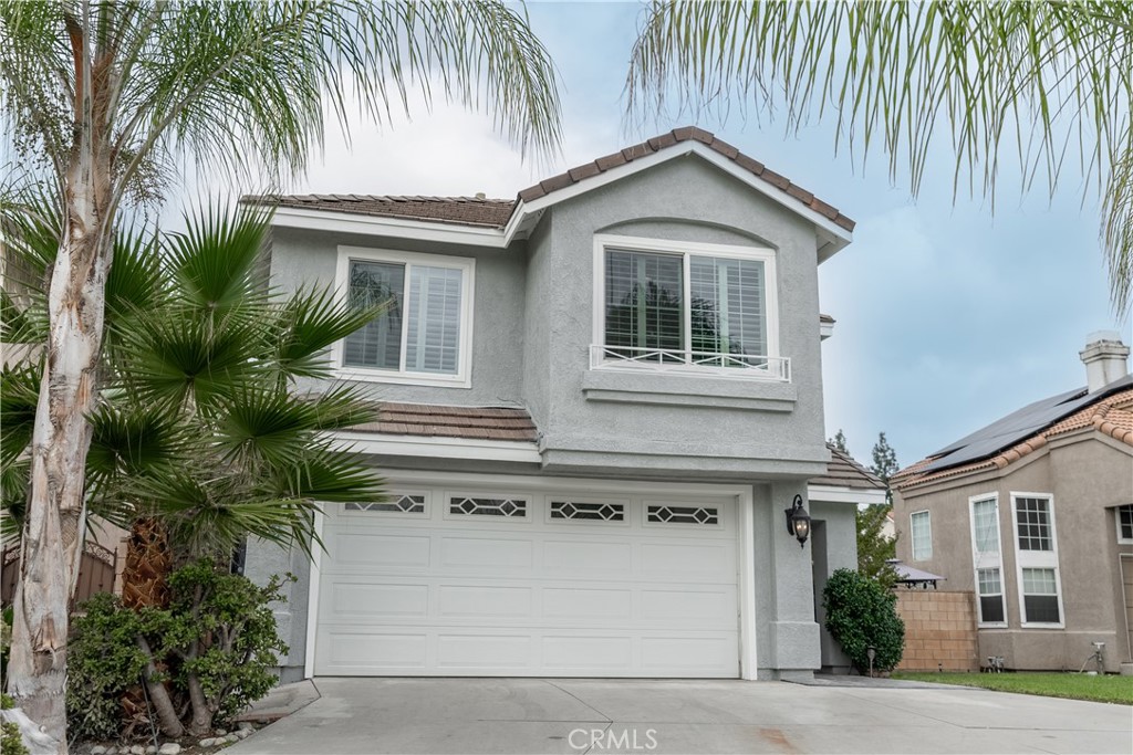 a front view of a house with a garage