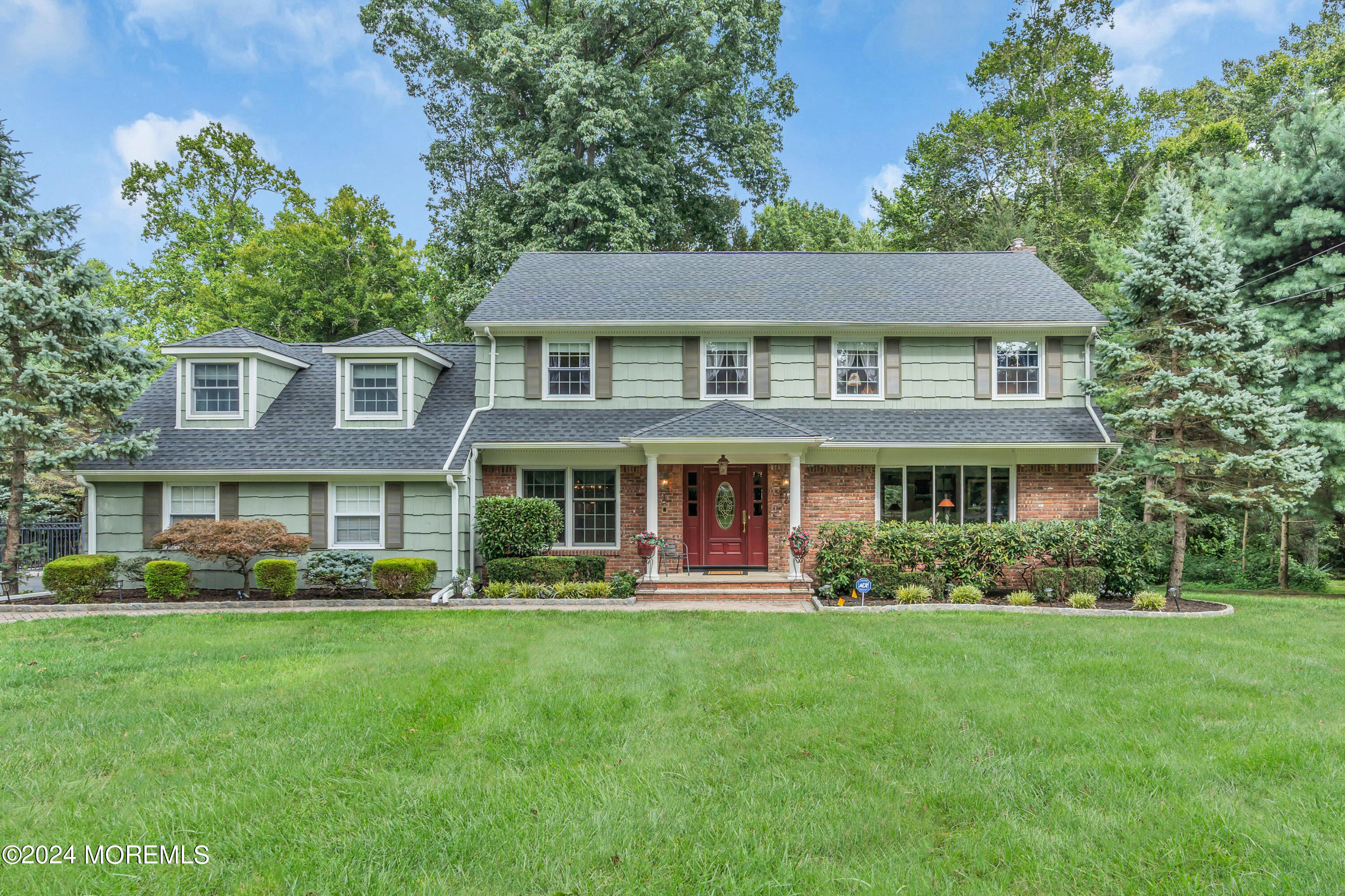 front view of a house with a yard