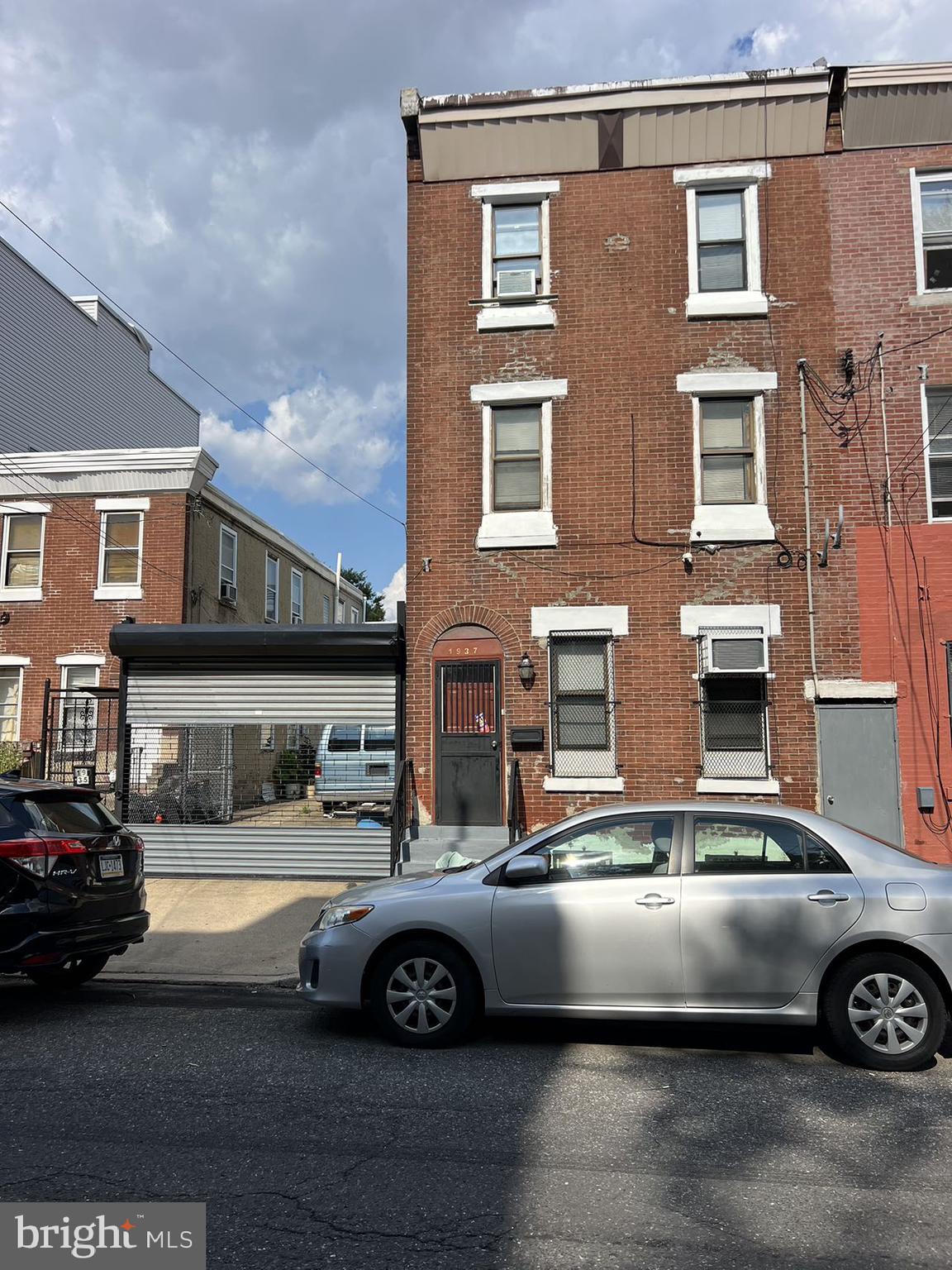 a front view of a house with parking space