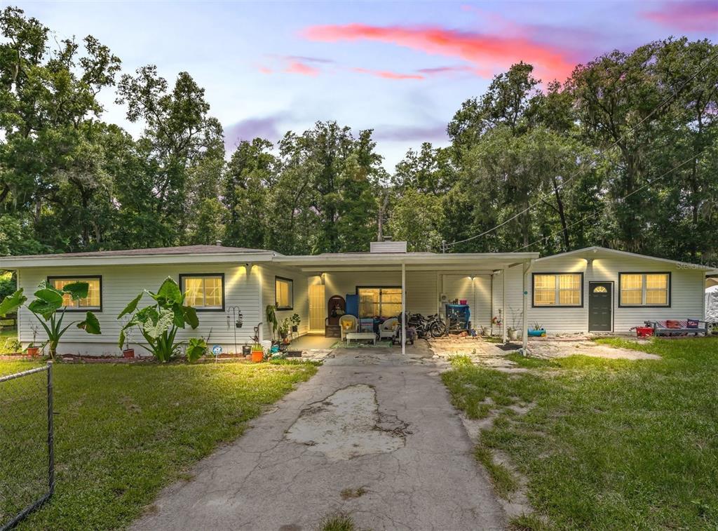 aerial view of a house with backyard