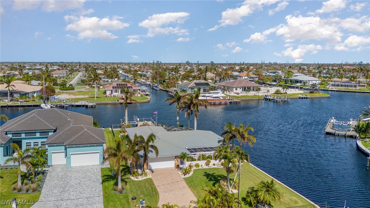 an aerial view of a house with a lake view