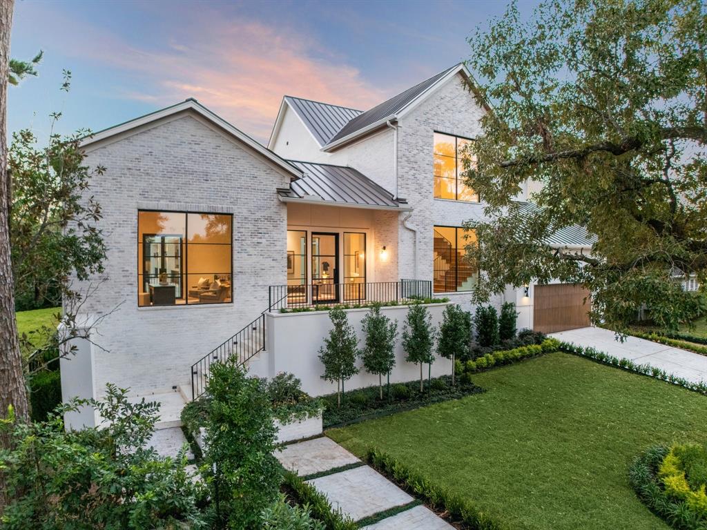 This stunning new construction home by Nest Luxury Homes is situated on an expansive 20,190-square-foot lot in the prestigious River Oaks neighborhood. The vast, verdant lawn offers ample space for a pool or lush gardens, creating endless outdoor possibilities. A spacious loggia provides a perfect covered perch to relax and enjoy the serene surroundings.