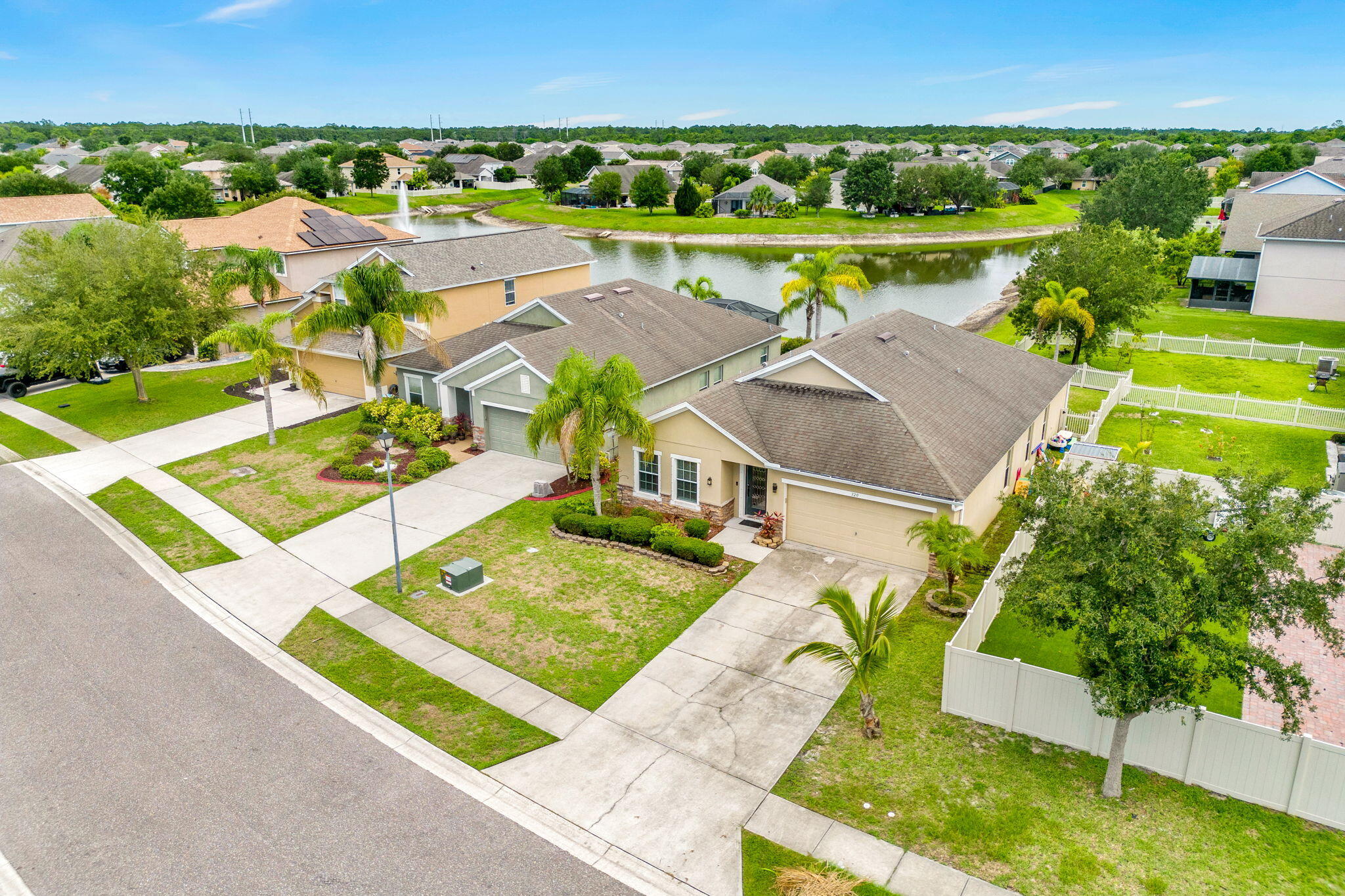 an aerial view of a house with a ocean view