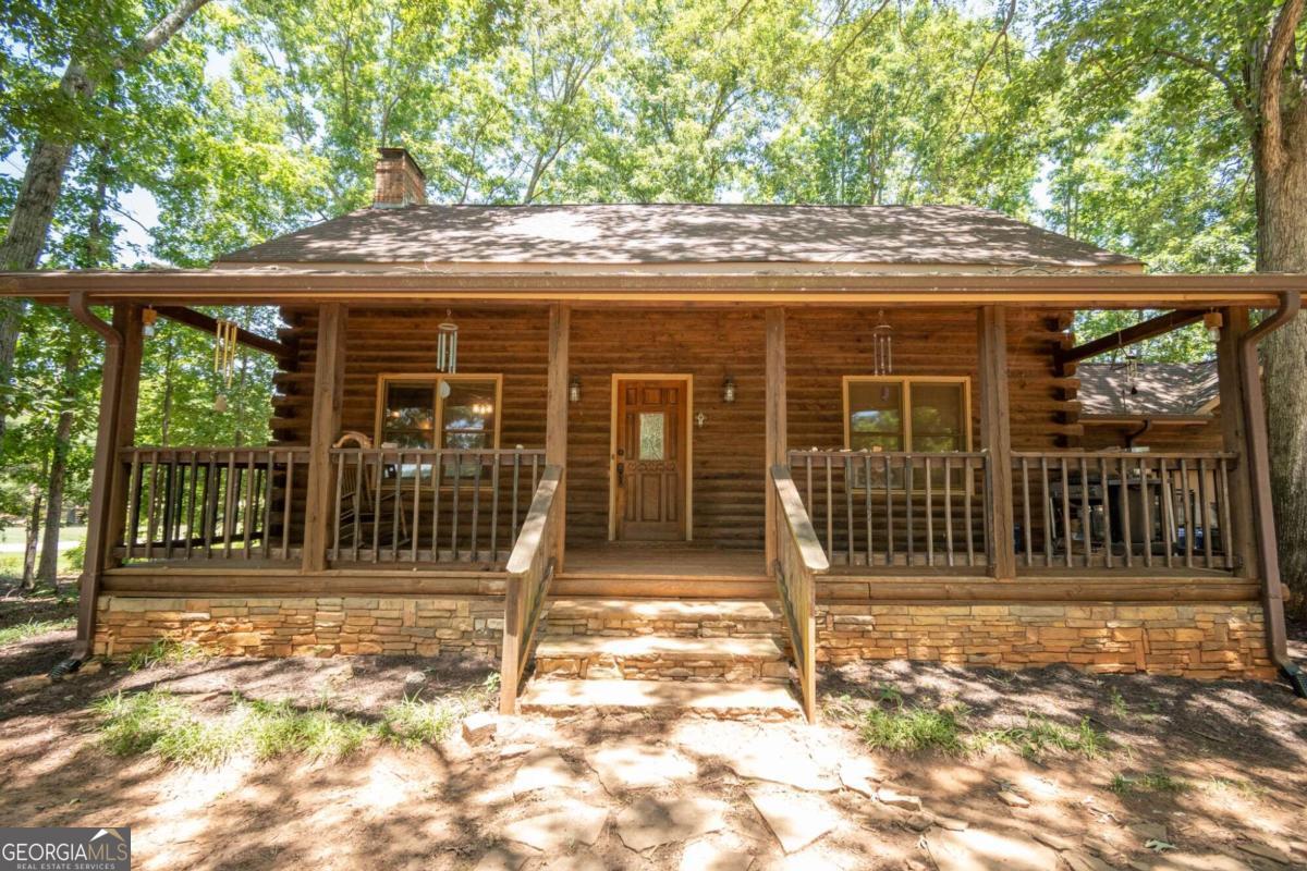 a front view of a house with a porch