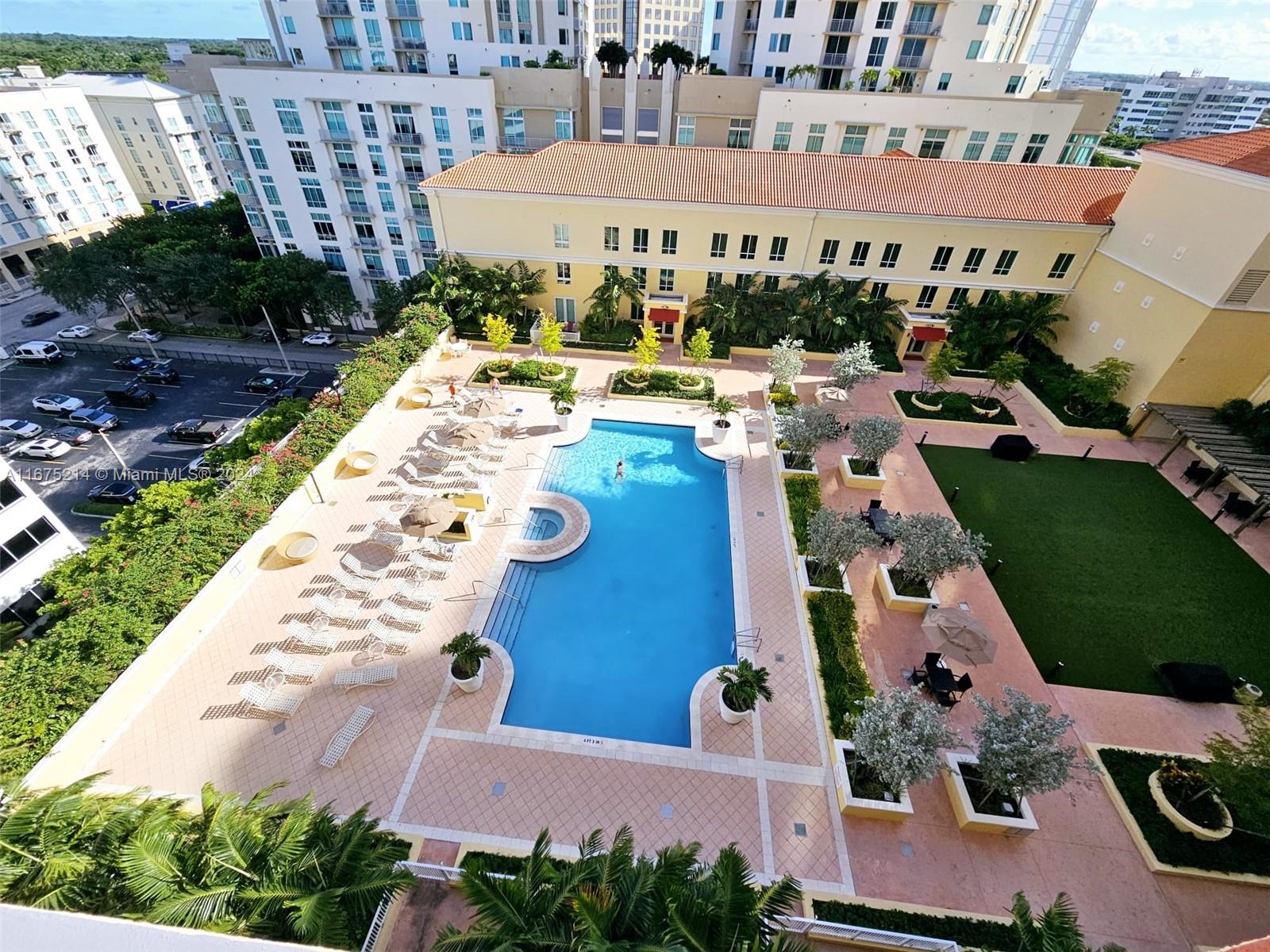 a view of a swimming pool with outdoor seating