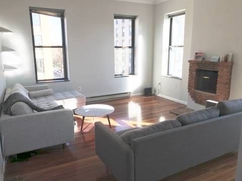 a living room with furniture and window