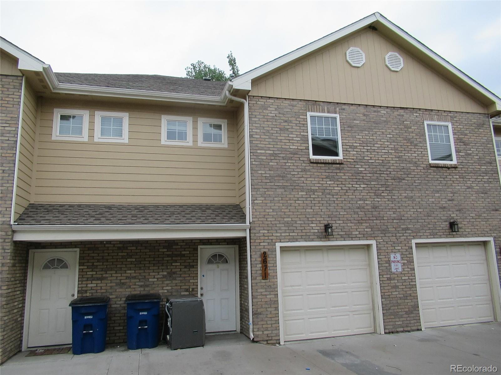 a front view of a house with garage