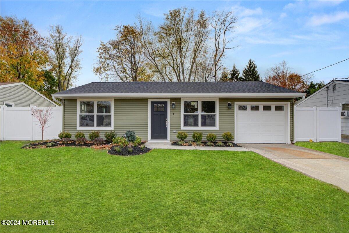 front view of a house with a yard