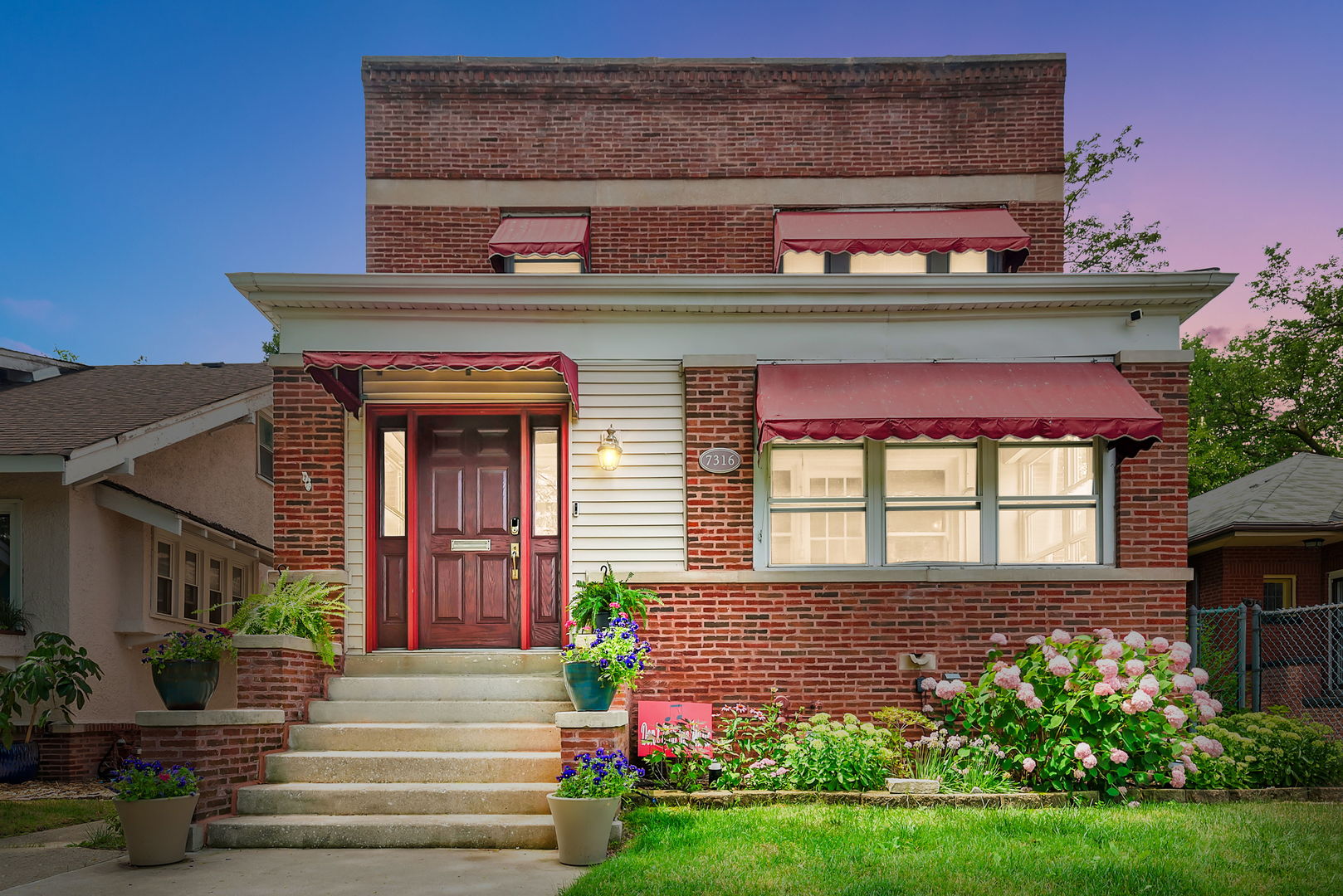 a front view of a house with garden