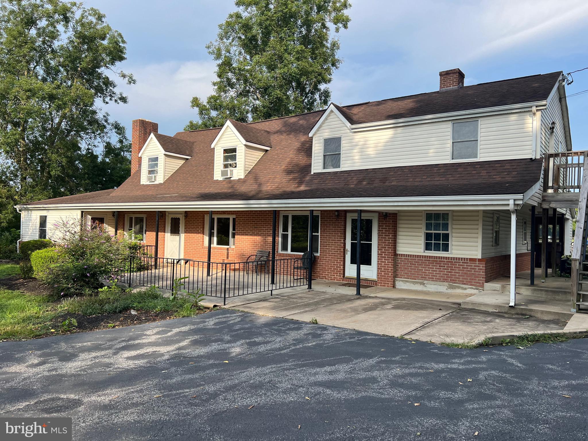 a front view of a house with a porch