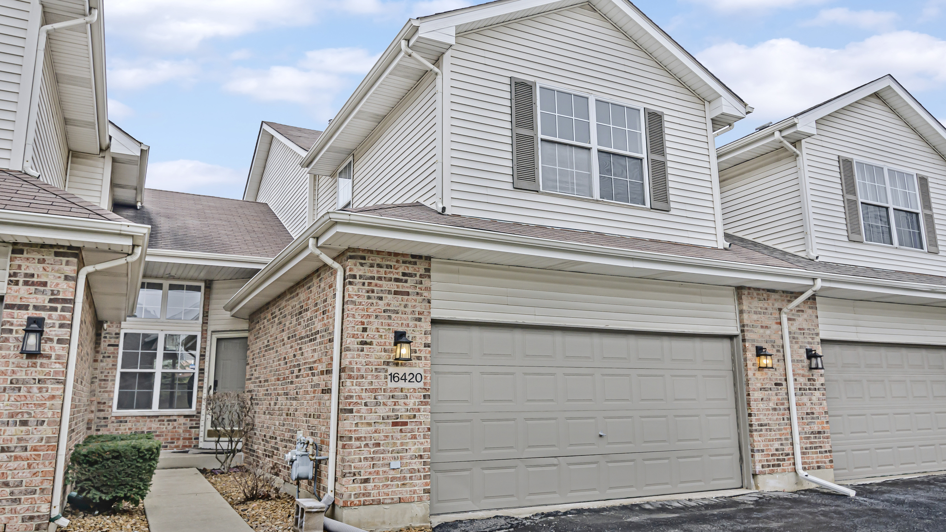 a front view of a house with a garage