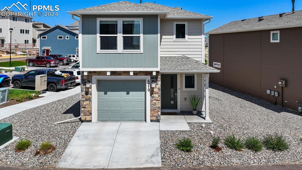 a front view of a house with a garage