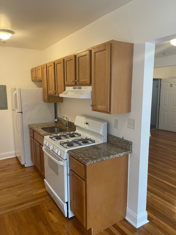 a kitchen with a stove top oven