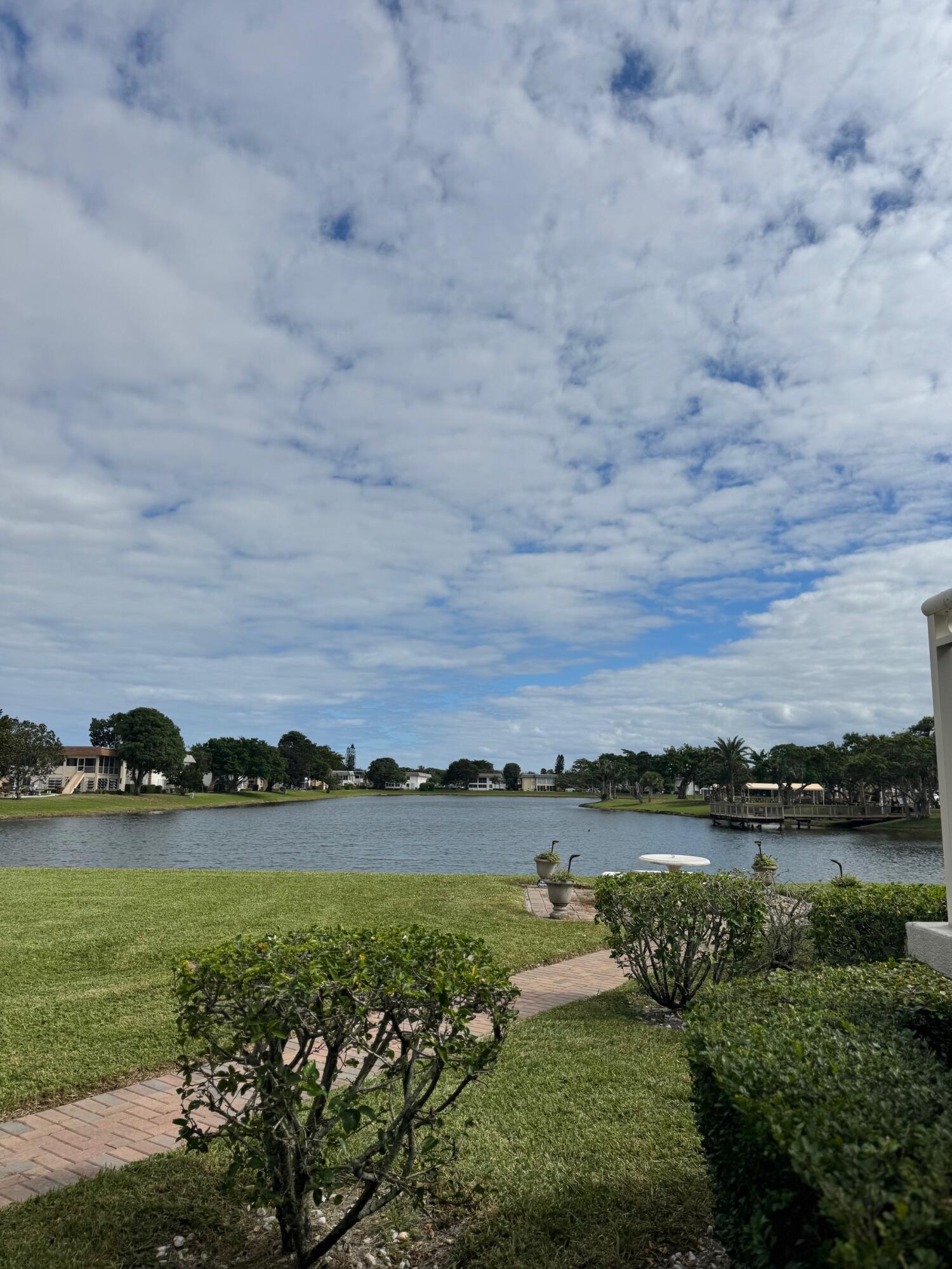 a view of a lake with houses in the background