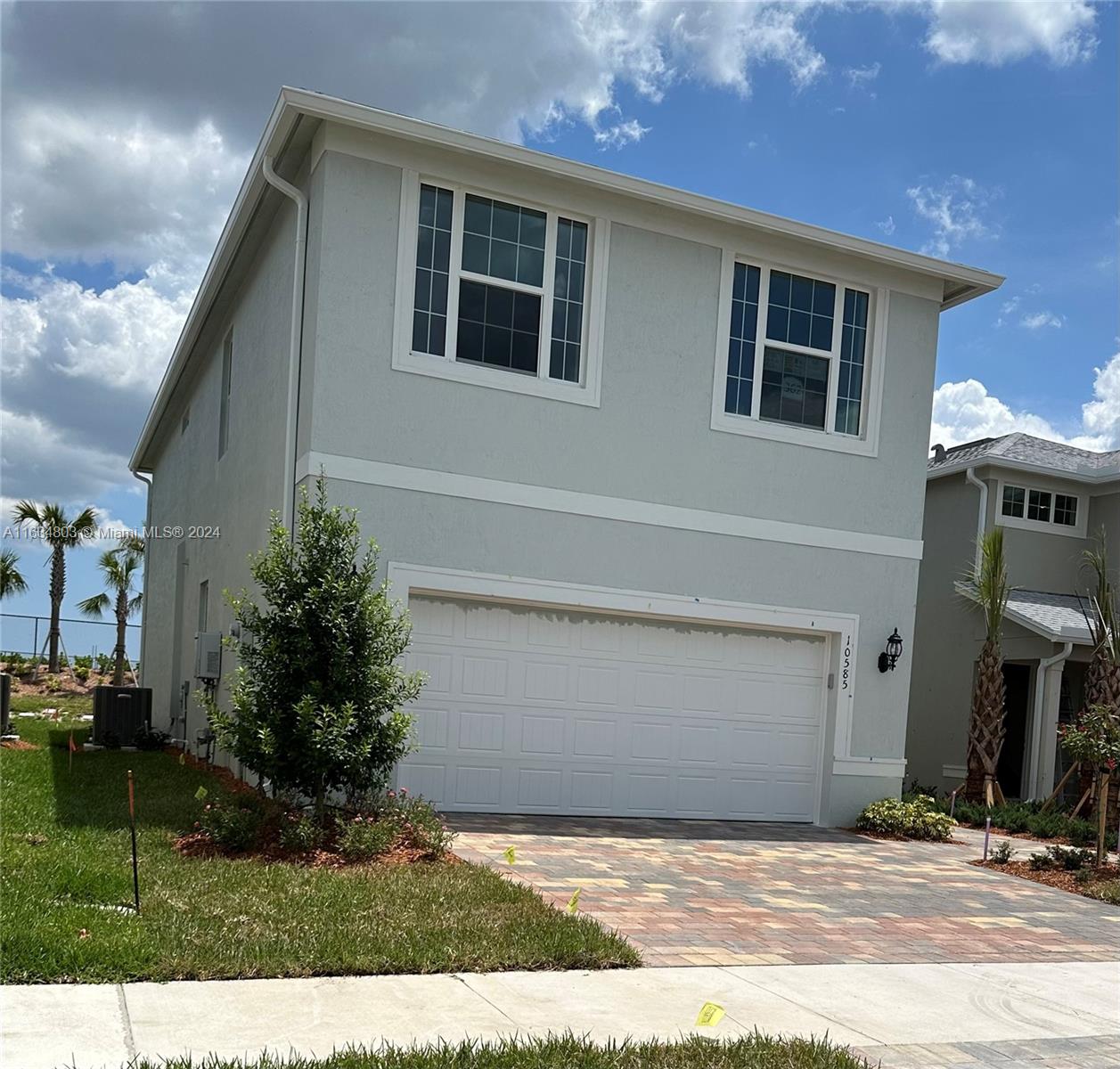 a front view of a house with yard