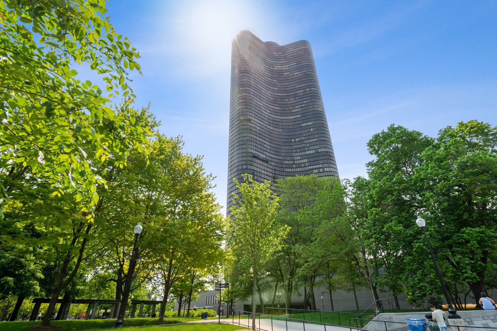 a tall building with trees in front of it