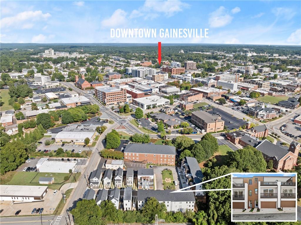 an aerial view of a residential apartment building with parking space