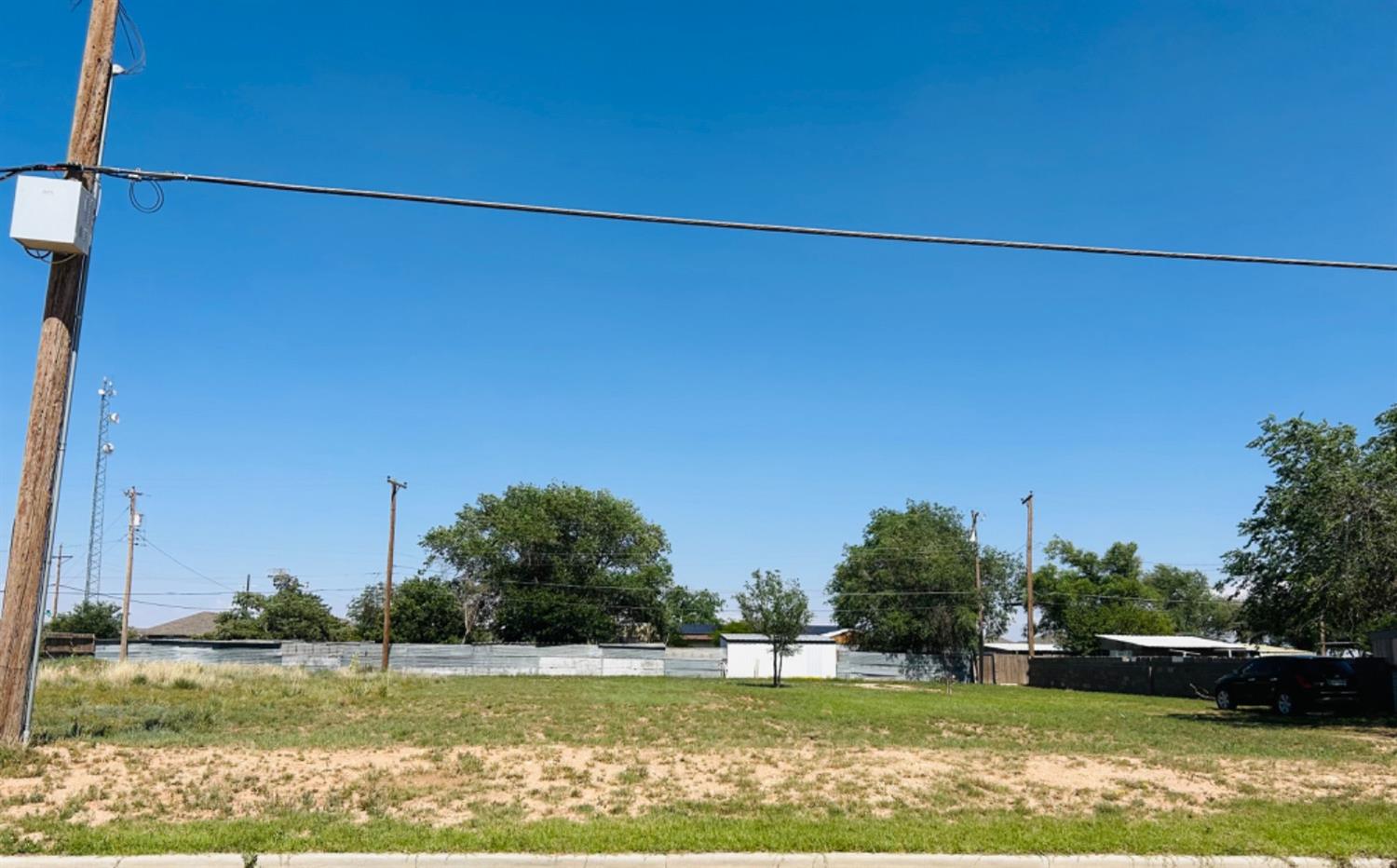 a view of a swimming pool and a yard