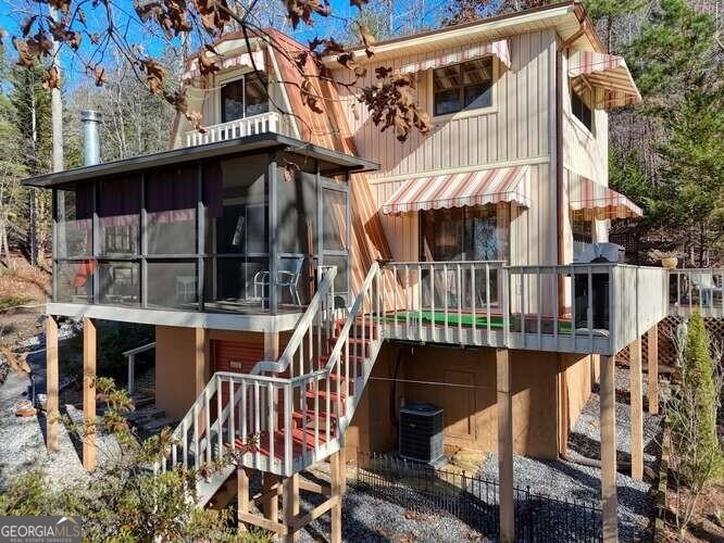 a view of a house with iron fence