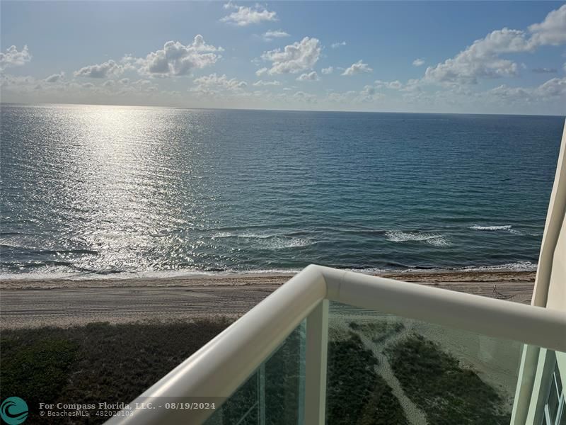 a view of ocean from a balcony