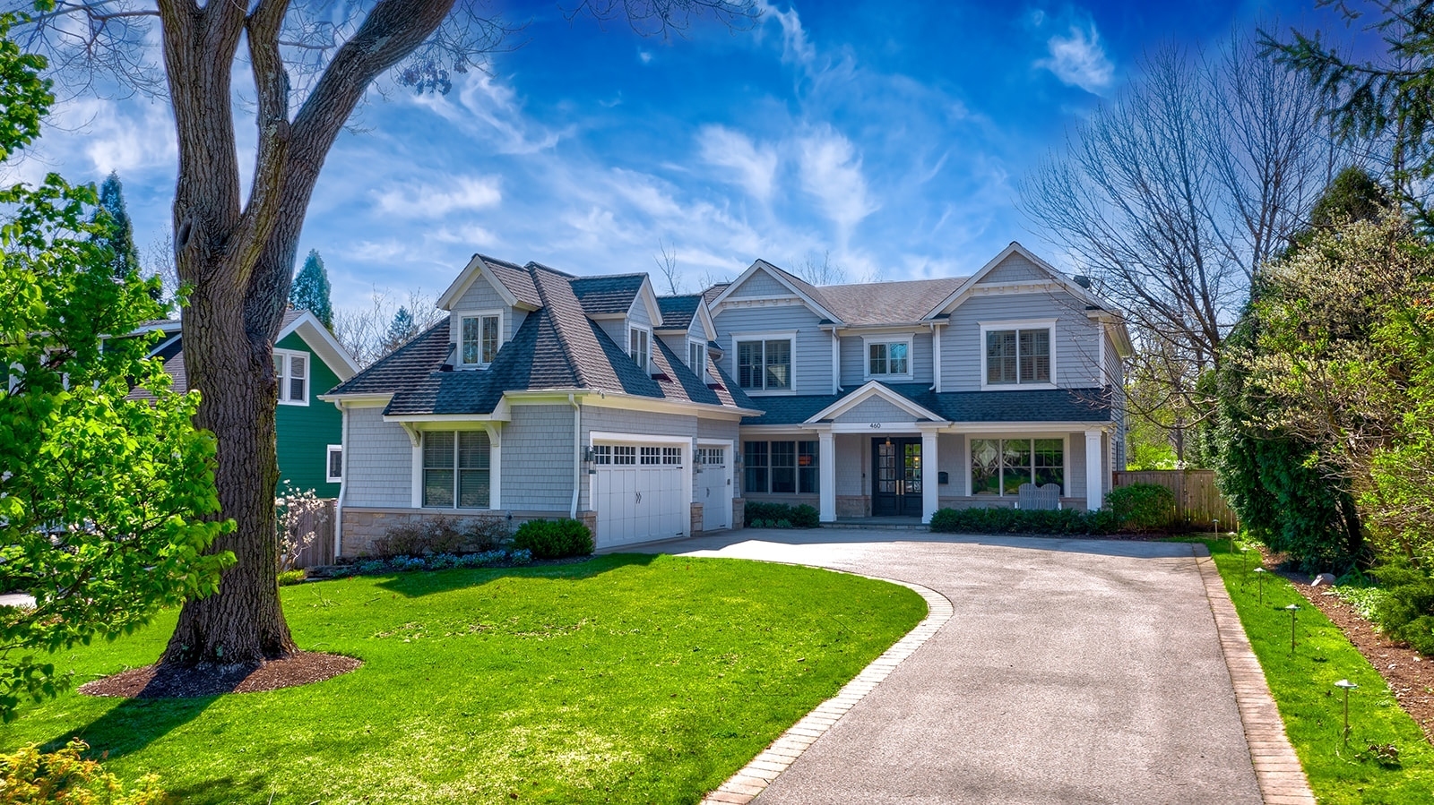 a front view of a house with a yard