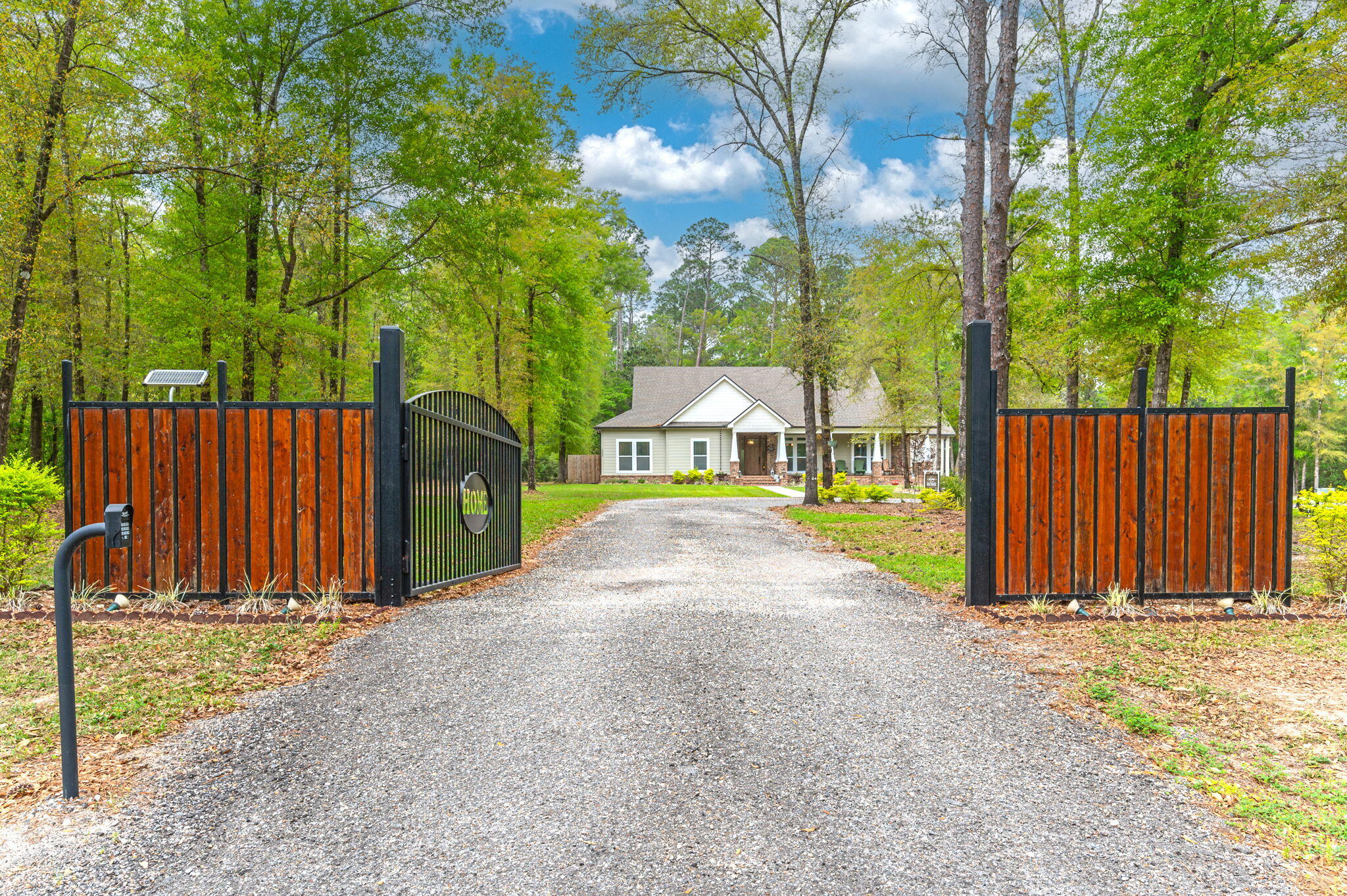 a view of a street with wooden fence