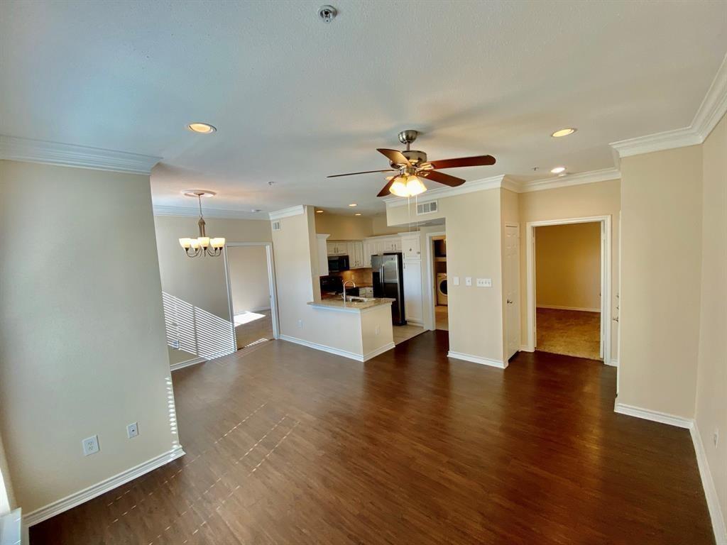 a view of an empty room and wooden floor